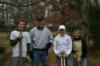 Dylan Baggette, Bob Bisson, Tina Brown, and Robin Harper rest after digging post holes for a handicap ramp.