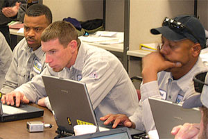 Line technicians concentrate on learning the new map-viewing software.