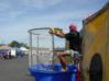 Bob Bunek, corporate buyer, makes sure ball throwers get as wet as he is at the dunk tank.