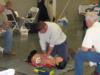 Anthony Franchini, apprentice line technician, is tested in the CPR/AED competition.