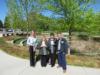 Manassas Park Elementary Principal Stacey R. Mamon and Assistant Principal Melissa Pitts accept trees seedlings from Donna Snellings, NOVEC public and government relations liaison, and Eddie Bartalos, a NOVEC employee and Manassas Park resident. Photo by Priscilla Knight