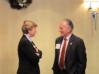 NOVEC Director Cynthia Gilbride speaks with Delegate C. Chuck Caputo at meeting in Manassas on Dec. 18, 2008.